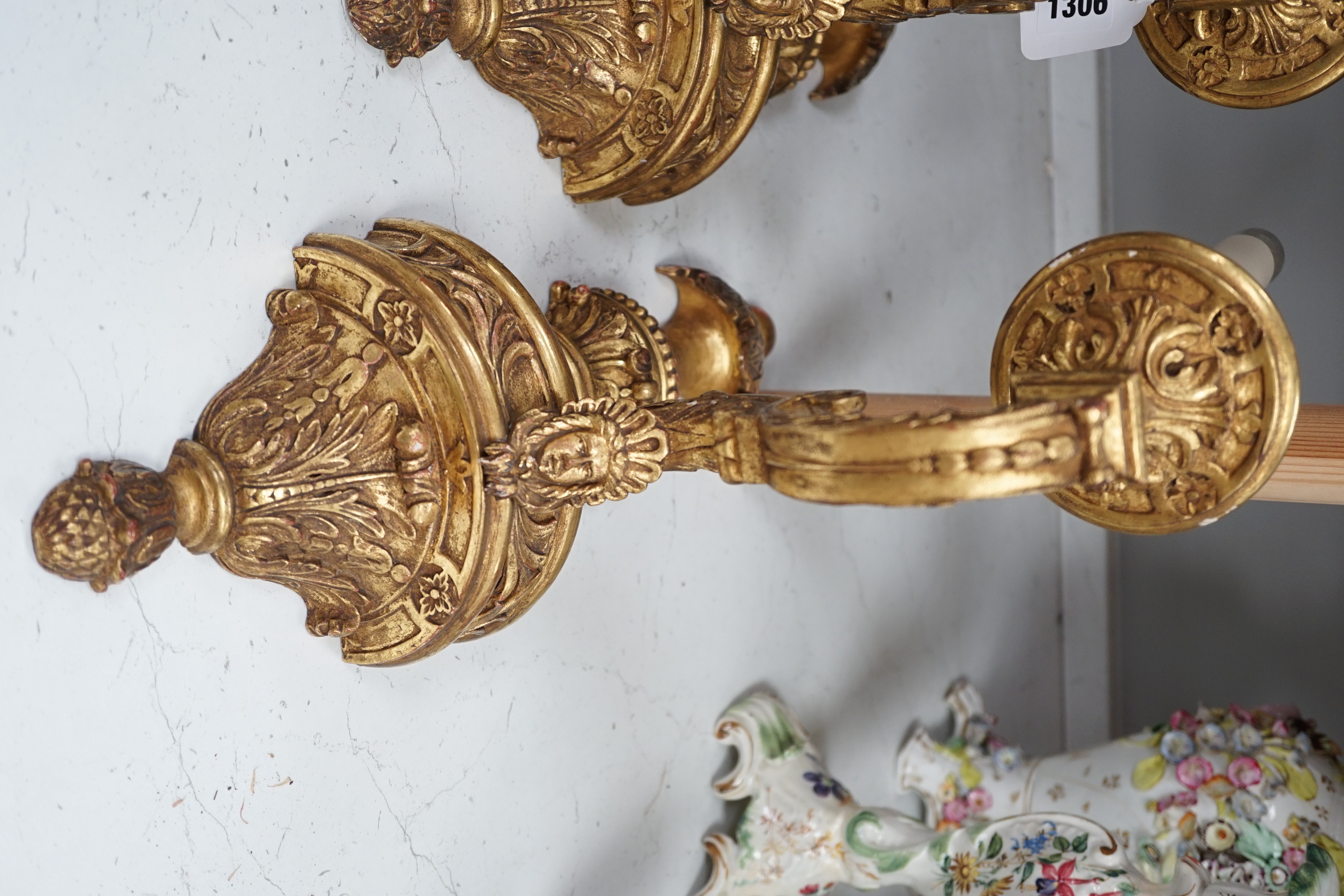 A pair of giltwood decorative single branch wall sconces - approx 50cm long
